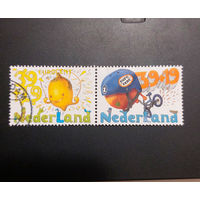 Нидерланды 2004. Детские марки. Спорт. Лимон. Апельсин (сцепка из 2 марок)