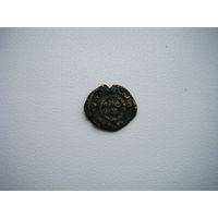 Древняя медная восточная монета.